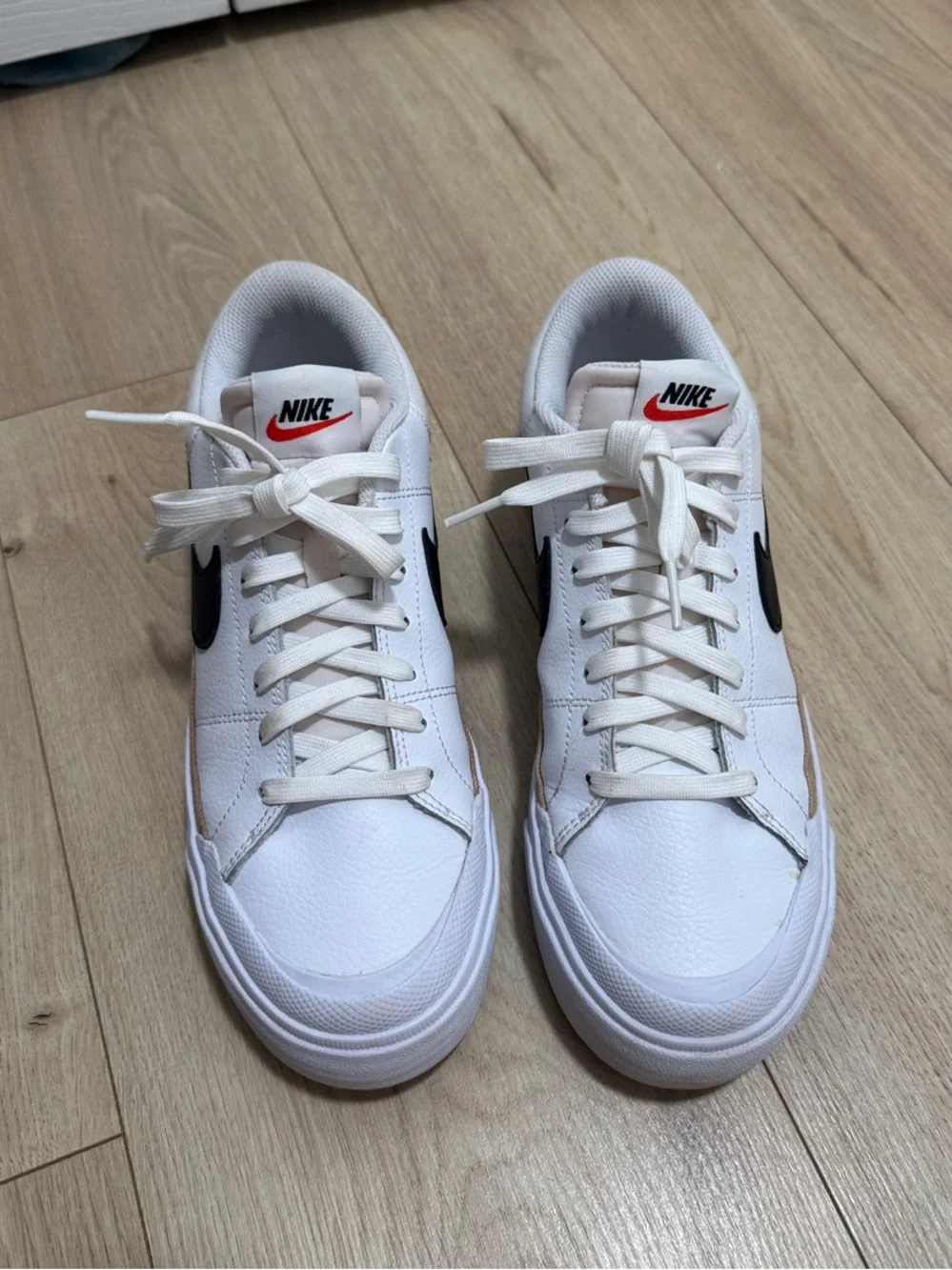 Nike Women’s White Sneakers with Black Swoosh and Tan Accent